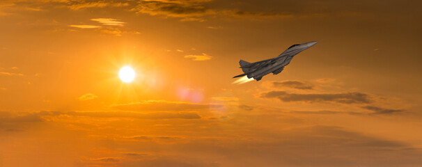 Combat aircraft MIG-29 against the backdrop of the sunset sky