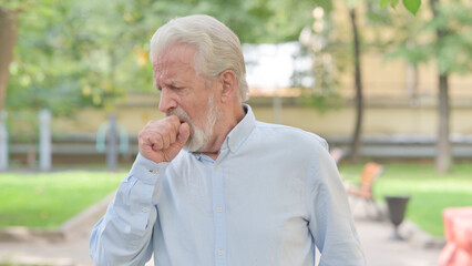 Outdoor Portrait of Senior Old Man Coughing