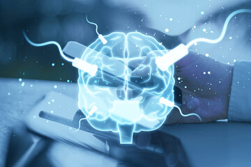 Close up of businessman hand using tablet and cellphone with glowing connected brain hologram on blurry outdoor background. AI, mind and neurology concept. Double exposure. - obrazy, fototapety, plakaty