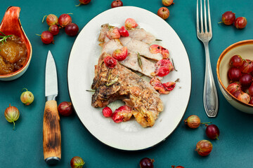 Beef steak with berry sauce.