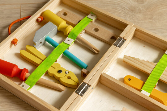 Wooden Children's Tools. Wooden Products For The Development Of Motor Skills And The Child's Brain. Games For Kids, Equipment Like Adults. Hammer, Screwdriver, Pliers