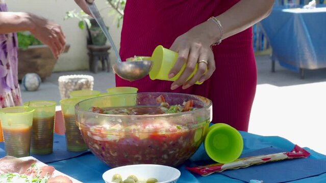 woman serving ceviche fresh aperitive summertime latin american food in a bowl outdoors