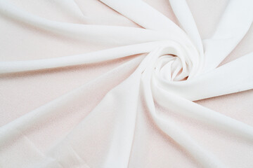 a captivating spiral shape is emphasized in a mockup image of a cloth arranged in a minimalist setup