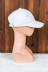 With an air of sophistication, a white blank hat enhances a fashion head doll in this captivating...