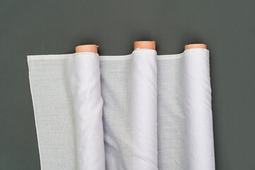 a mockup image of a fabric roll within a minimalistic setup