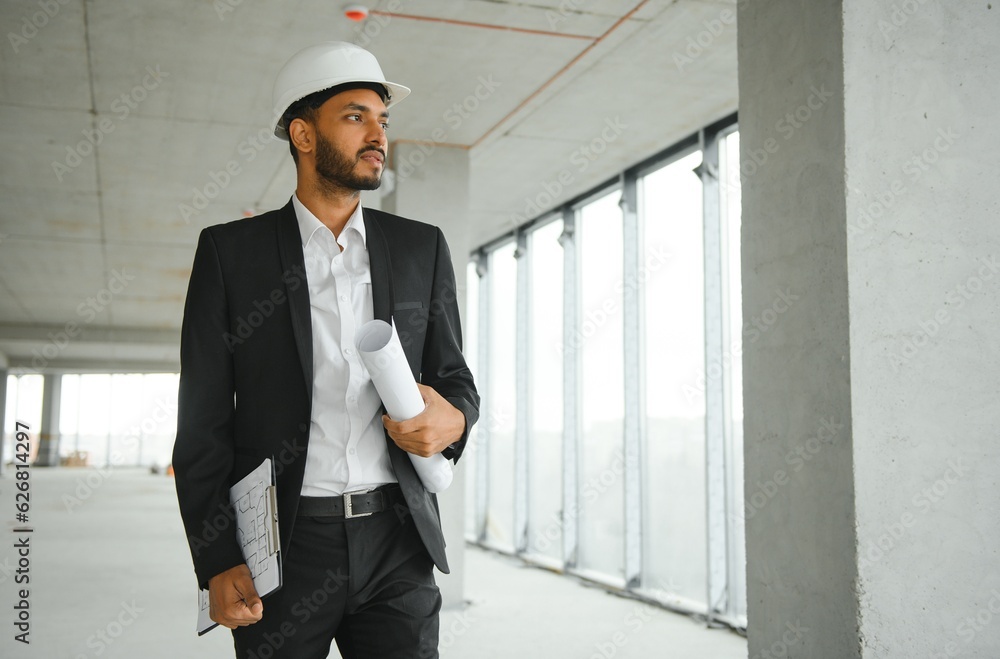 Wall mural architecture, construction business and building concept - happy smiling indian male architect in he