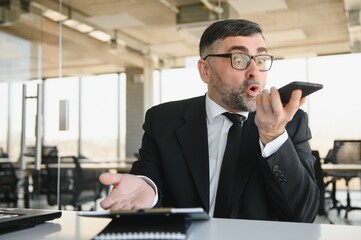 Angry mad frustrated businessman talking on phone complaining on bad service solving business...