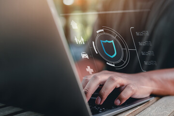 insurance, protection, assurance, family, health, saving, finance, life, shielding, healthcare. typing on keyboard with shield hud symbolizing life insurance asset protection family safety.