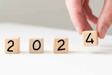 New year 2024 concept. business idea over wooden board