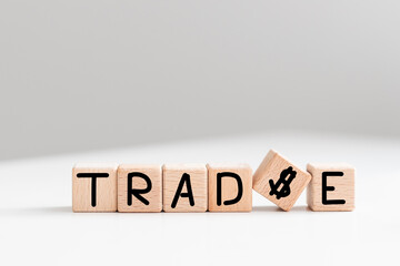 TRADE word written on wood block on a light background