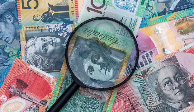 Magnifying glass on australian dollar banknote, macro