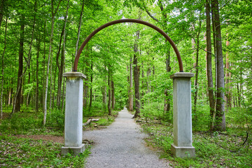 Trail, paved path through Walkway of Roses in destroyed amusement park Rose Island, portal