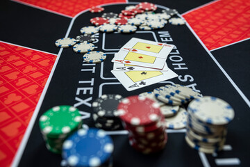 4 four play card with chips on  casino table