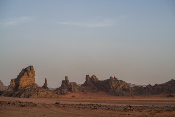 view in the Sahara desert of Tadrart rouge tassili najer in Djanet City  ,Algeria.colorful orange sand, rocky mountains - obrazy, fototapety, plakaty