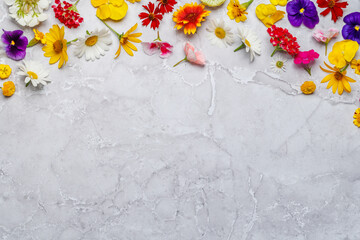 Assorted flowers on marble backdrop