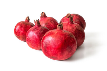 Red pomegranate fruits on a white background