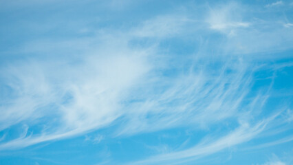 blue background on the photo white clouds and blue sky