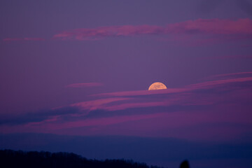 Mystical landscape with full moon rise in the cold season. The natural satellite of the earth...
