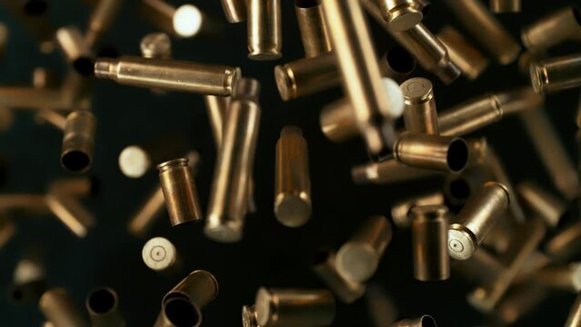 Super Slow Motion Shot of Used Real Gun Bullets Flying Towards Camera at 1000fps.