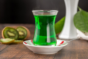 Winter drink kiwi oralet or oralette in a thin-waisted glass tea glass