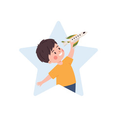 Happy cute boy holding small airplane, kid plays with favorite toy cartoon vector illustration isolated in star shaped