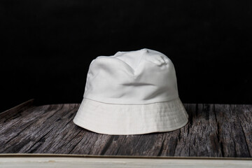 A captivating mockup image captures the allure of a white blank bucket hat worn by a fashion head...