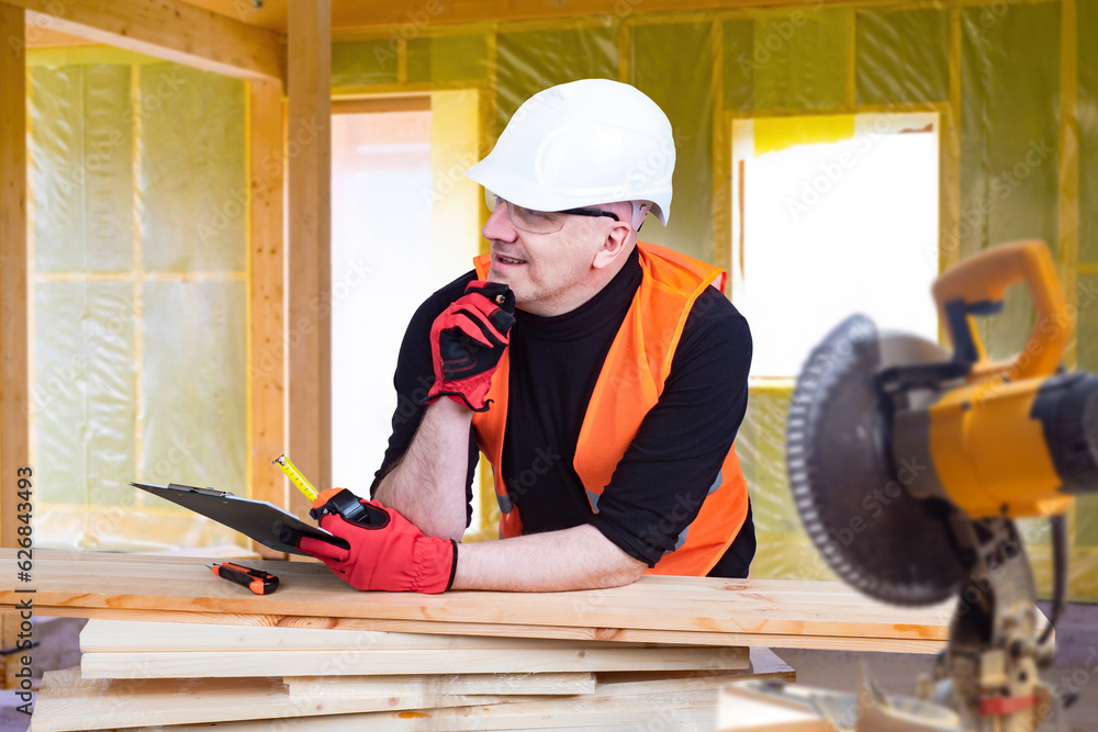 Poster man carpenter. builder thought. carpenter near planks and circular saw. guy in construction uniform.