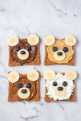 Breakfast toasts with nut butter and banana with cute funny bear face