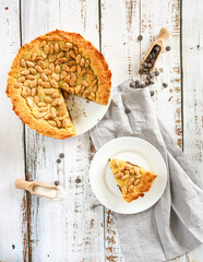 Homemade cheesecake with chocolate and almond on wooden table