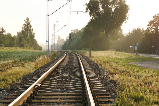 Railway tracks at sunrise. Lublin Poland. Railroad tracks under the rising sun.