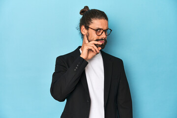 Businessman in suit with eyeglasses and beard trying to listening a gossip.