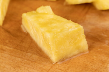 ripe yellow pineapple cut into pieces