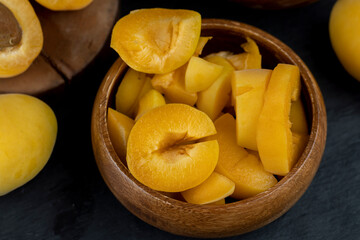 ripe yellow apricots on the table close-up
