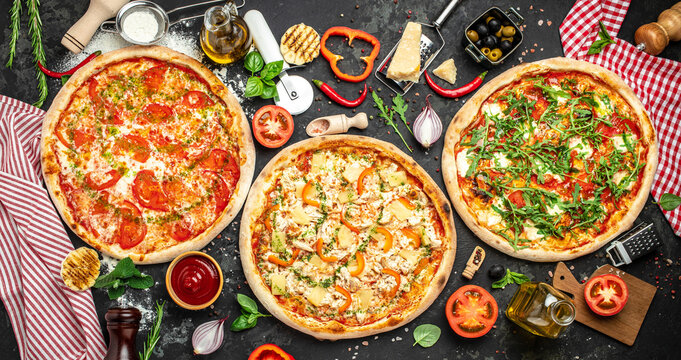 pizza set on a dark background, Fast food lunch, Long banner format. top view