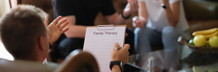 Husband and wife speak with a psychologist, close-up