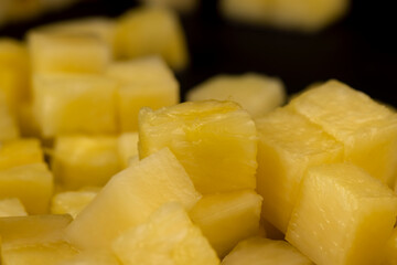 sliced ripe yellow pineapple, a large number of pieces