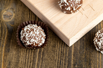 Chocolate candies with coconut flavor and filling