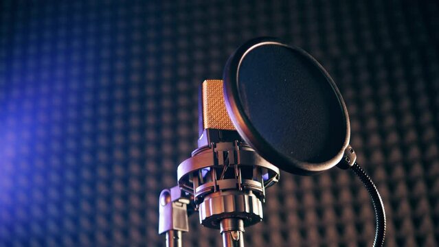A filter covering a professional microphone in the modern sound studio