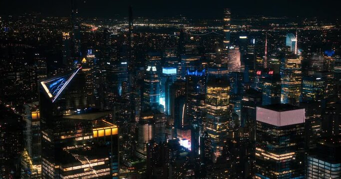 Aerial View of Manhattan Architecture at Night. Evening Footage of Financial Business District from a Helicopter. Scenery of Historic Office Towers, Including Illuminated 30 Hudson Yards Scyscraper