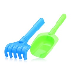 A set of children's toys for playing in the sandbox. Colored rake and shovel made of plastic, isolated on a white background, close-up. Early child development, children's leisure concept