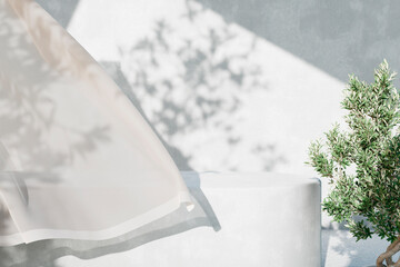 White concrete empty table, organic curtain and olive tree shadow on cement wall. Summer exterior scene for product placement mockup. Neutral minimal aesthetic. - obrazy, fototapety, plakaty