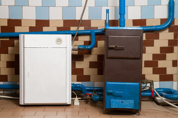 Heating system of a rural house. Gas boiler and solid fuel boiler.