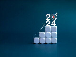 2024 year number with target icon and rise up arrow on white blocks as a graph steps on blue background. New year trends, action plan, profit, business growth process, economic improvement concepts. - Powered by Adobe