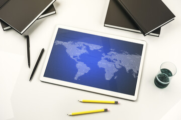 Modern digital tablet display with abstract creative world map, research and analytics concept. Top view. 3D Rendering