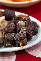 Delicious Korean cuisine Sundae and other pork edible viscera in market, street food.