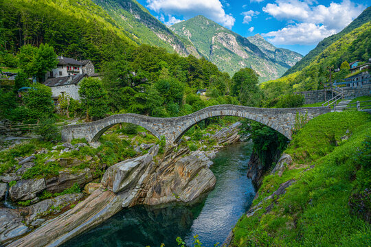 Roman bridge (Ponte dei Salti) crossing the Verzasca River at Lavertezzo in the Verzasca Valley, Canton of Ticino, Switzerland, Europe