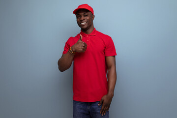 branded clothing concept. american man wearing a red t-shirt and cap on the background of ss copy...