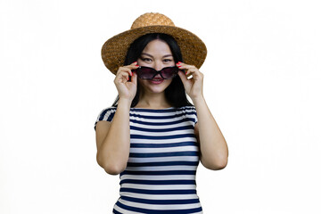 Young cheerful asian woman is wearing sunglasses. Isolated on white.