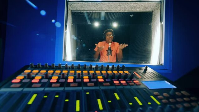 Music studio with an african singer getting recorded