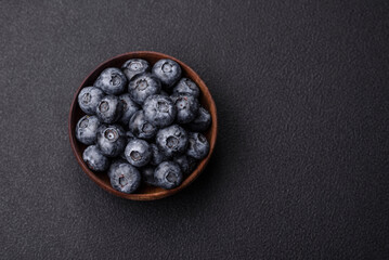 Delicious fresh sweet blueberries in a ceramic bowl. Vegan food